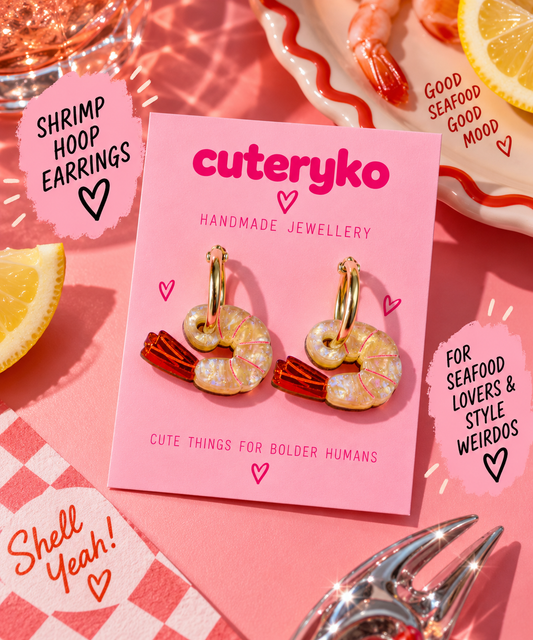 Shrimp hoop earrings with pearlescent pink-detailed shrimp charms and gold hoops by Cuteryko