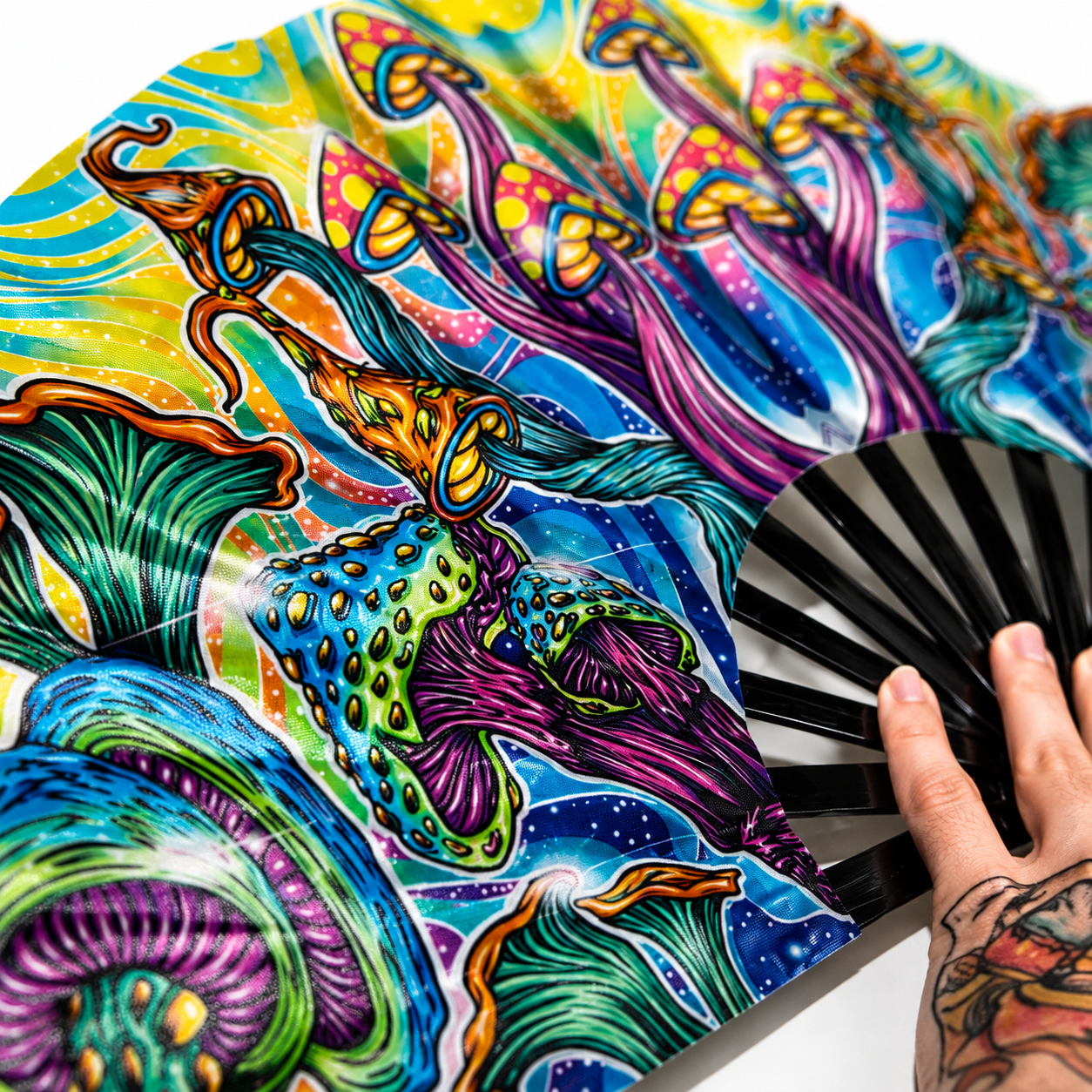 Close-up of psychedelic mushroom artwork printed on premium silky festival fan fabric