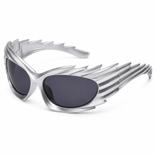 Silver futuristic spikey ridged festival sunglasses on white background