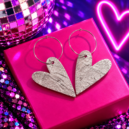 Silver heart hoop earrings with large metallic cork heart charms