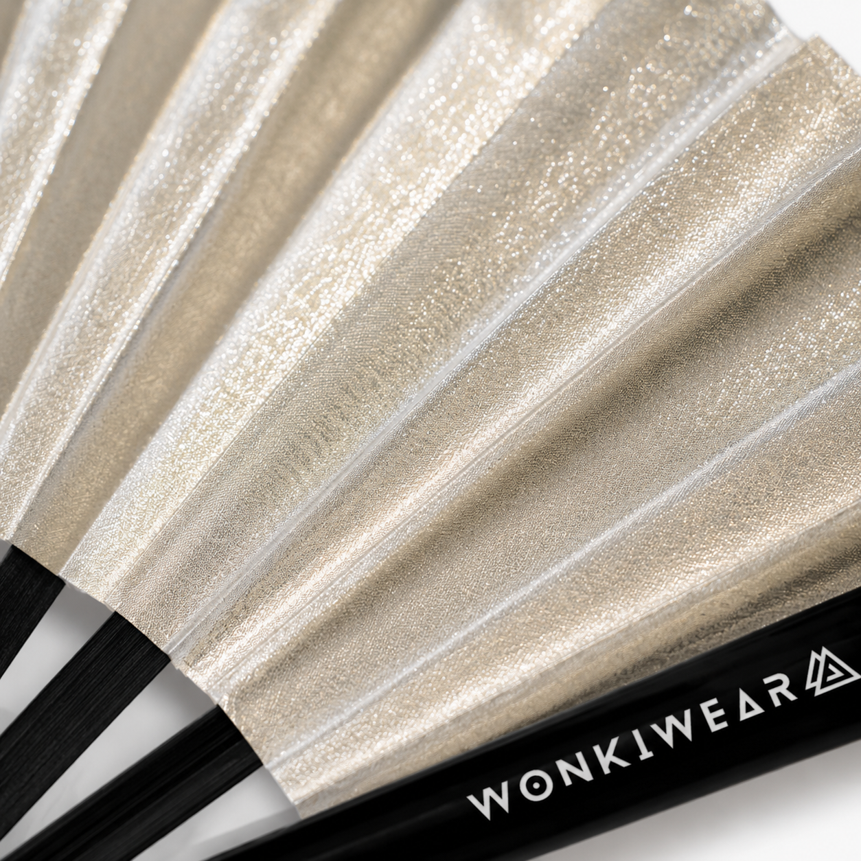 Close-up detail showing metallic silver shimmer texture on WonkiWear XL festival fan