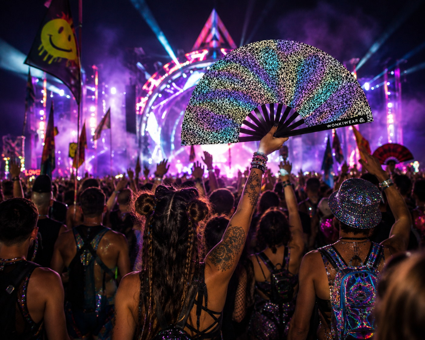 Person holding WonkiWear silver web reflective festival fan in rave crowd under colourful lights