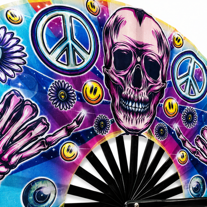 Close-up of colourful skull artwork and peace symbols on UV reactive festival fan