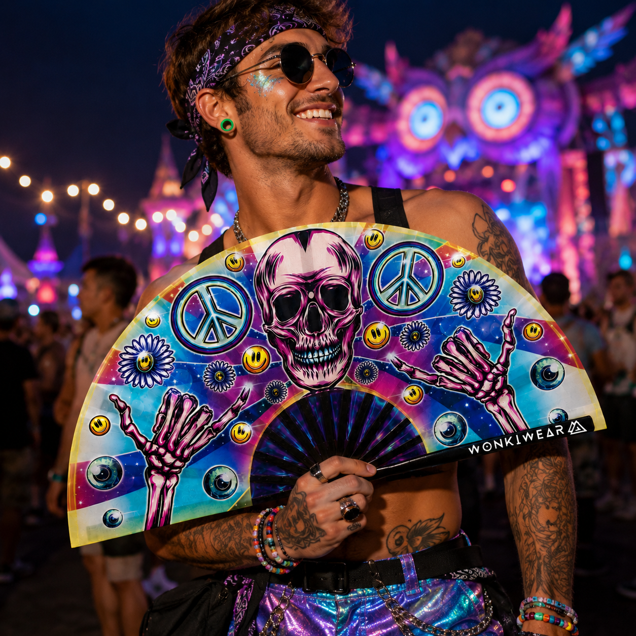 Skeleton Peace UV reactive festival fan being used outside a rave venue