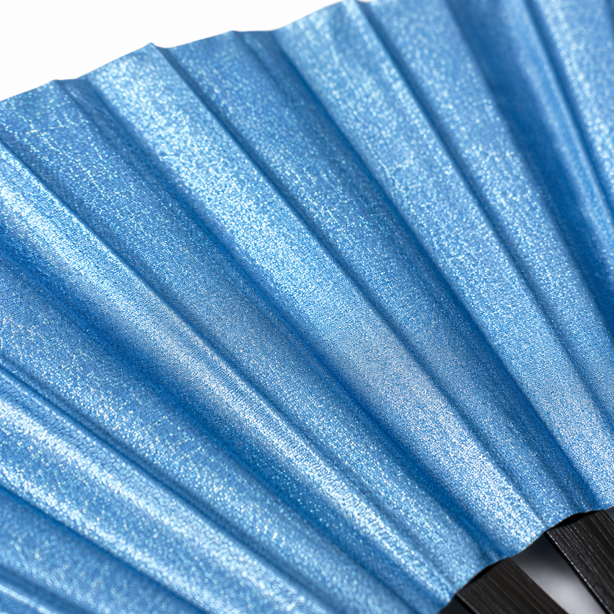 Close-up showing metallic sky blue shimmer texture on WonkiWear XL festival fan