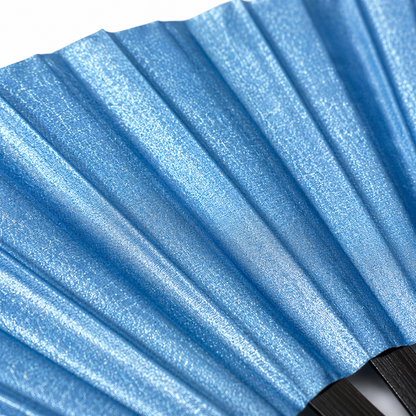 Close-up showing metallic sky blue shimmer texture on WonkiWear XL festival fan
