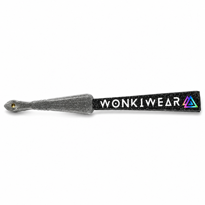Close-up of folded black glitter fan showing transparent plastic handle filled with silver glitter speckles