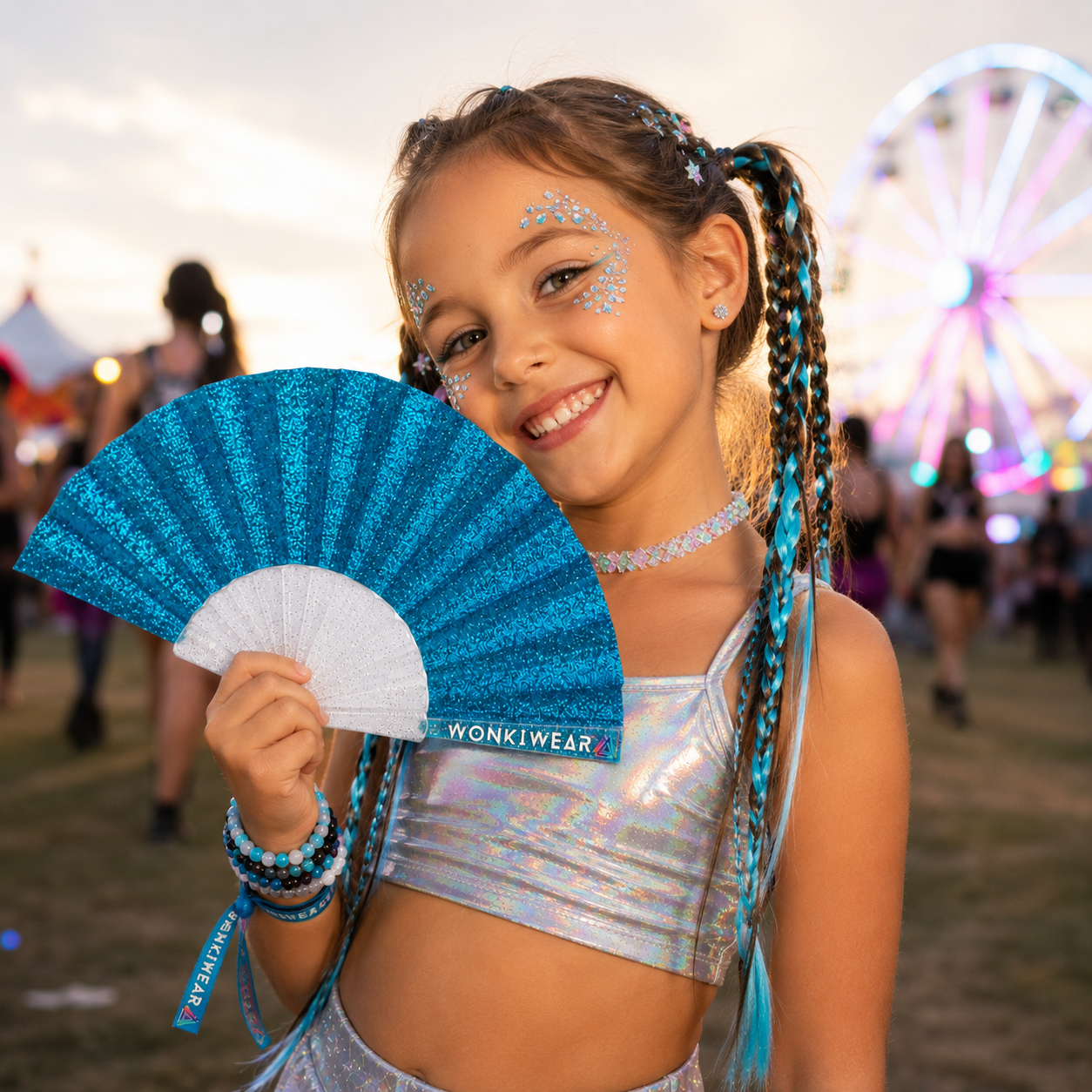 Child holding blue glitter folding fan at outdoor event