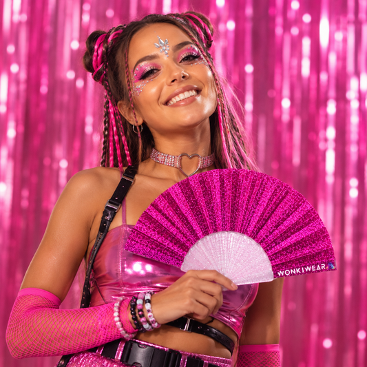 Studio photoshoot featuring bright pink glitter folding festival fan