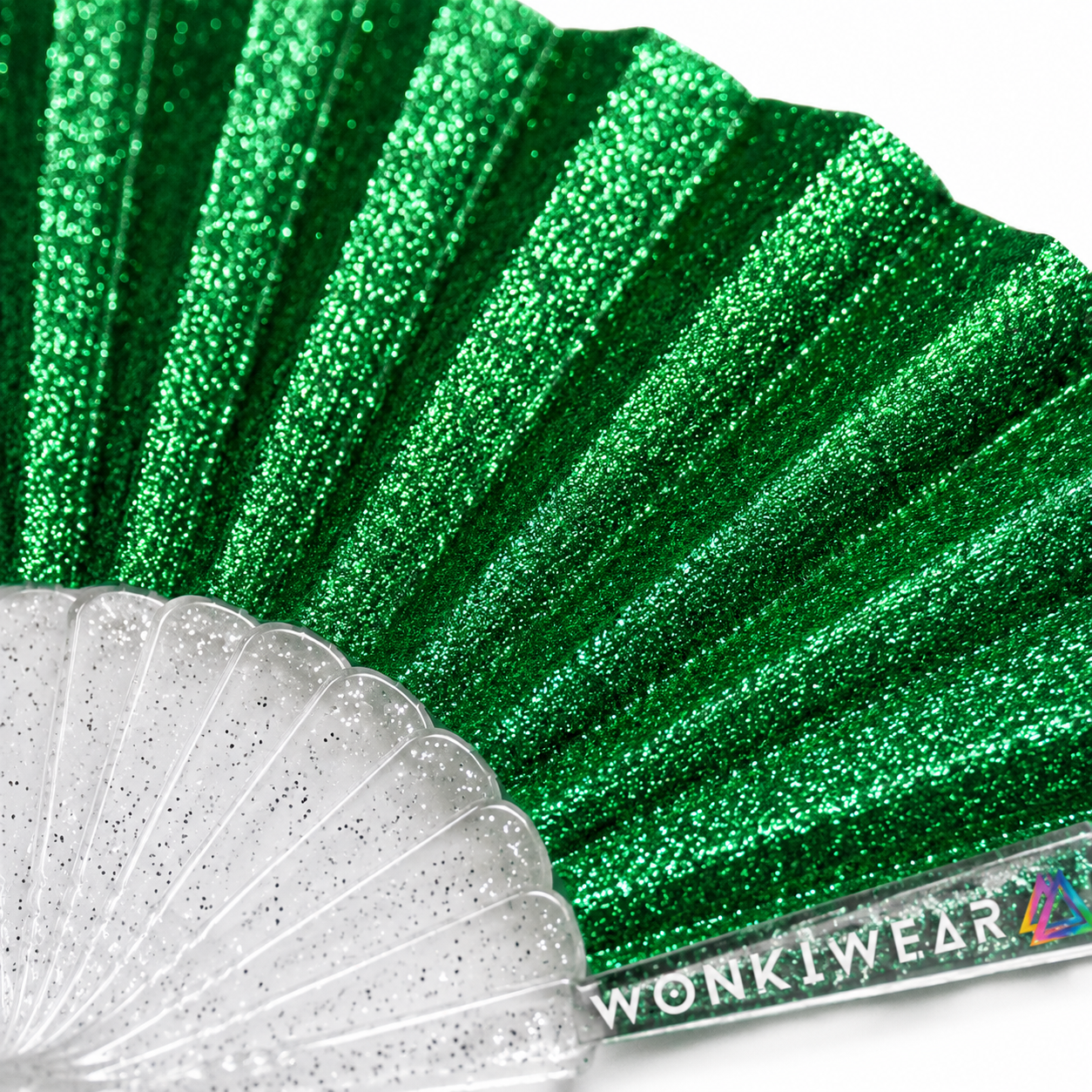 Macro close-up of emerald green glitter fabric showing sparkling texture and shimmer detail