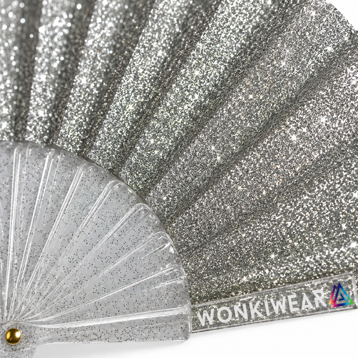 Macro close-up of silver glitter fabric showing sparkling shimmer texture and reflective detail