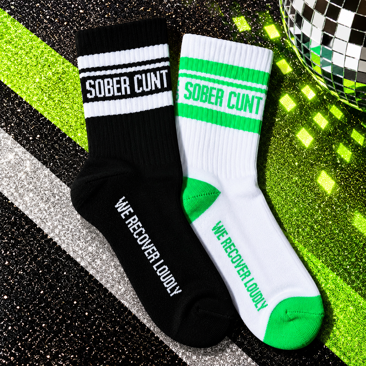 Sober Cunt black and green statement socks with bold cuff lettering and recovery message