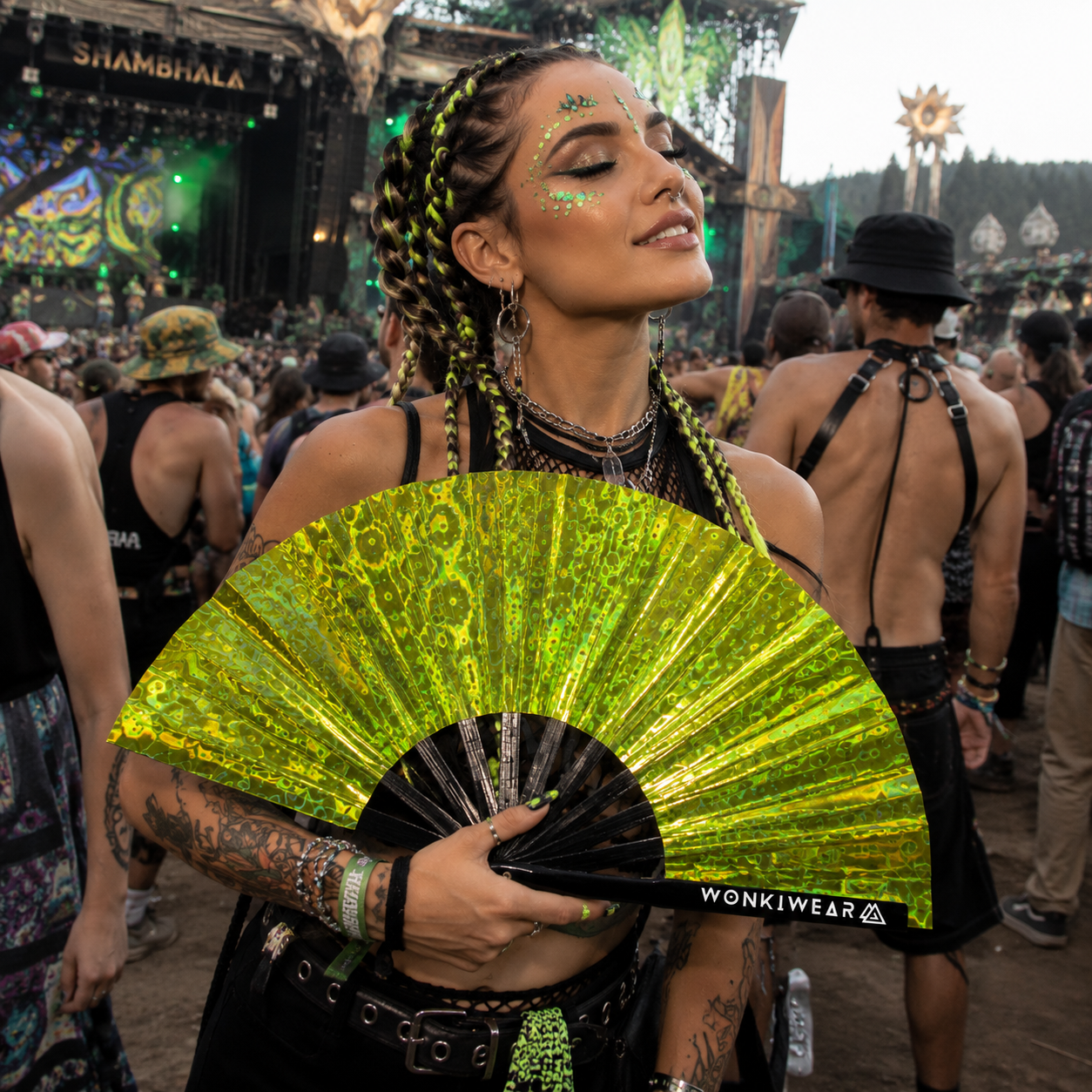 Festival attendee using Solar Flare holographic fan at outdoor music festival