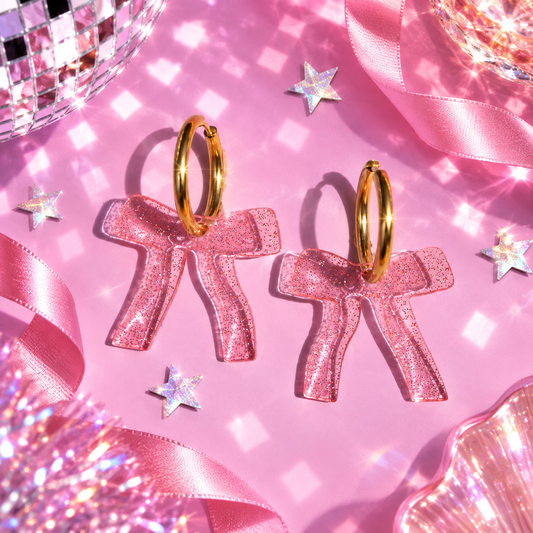 Sparkly pink bow hoop earrings with translucent glitter acrylic bow charms by Cuteryko