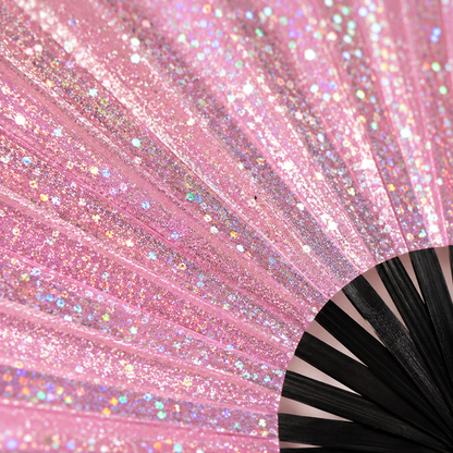 Close-up of pink glitter festival fan showing sparkling glitter finish