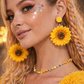 Model wearing sunflower earrings summer outfit