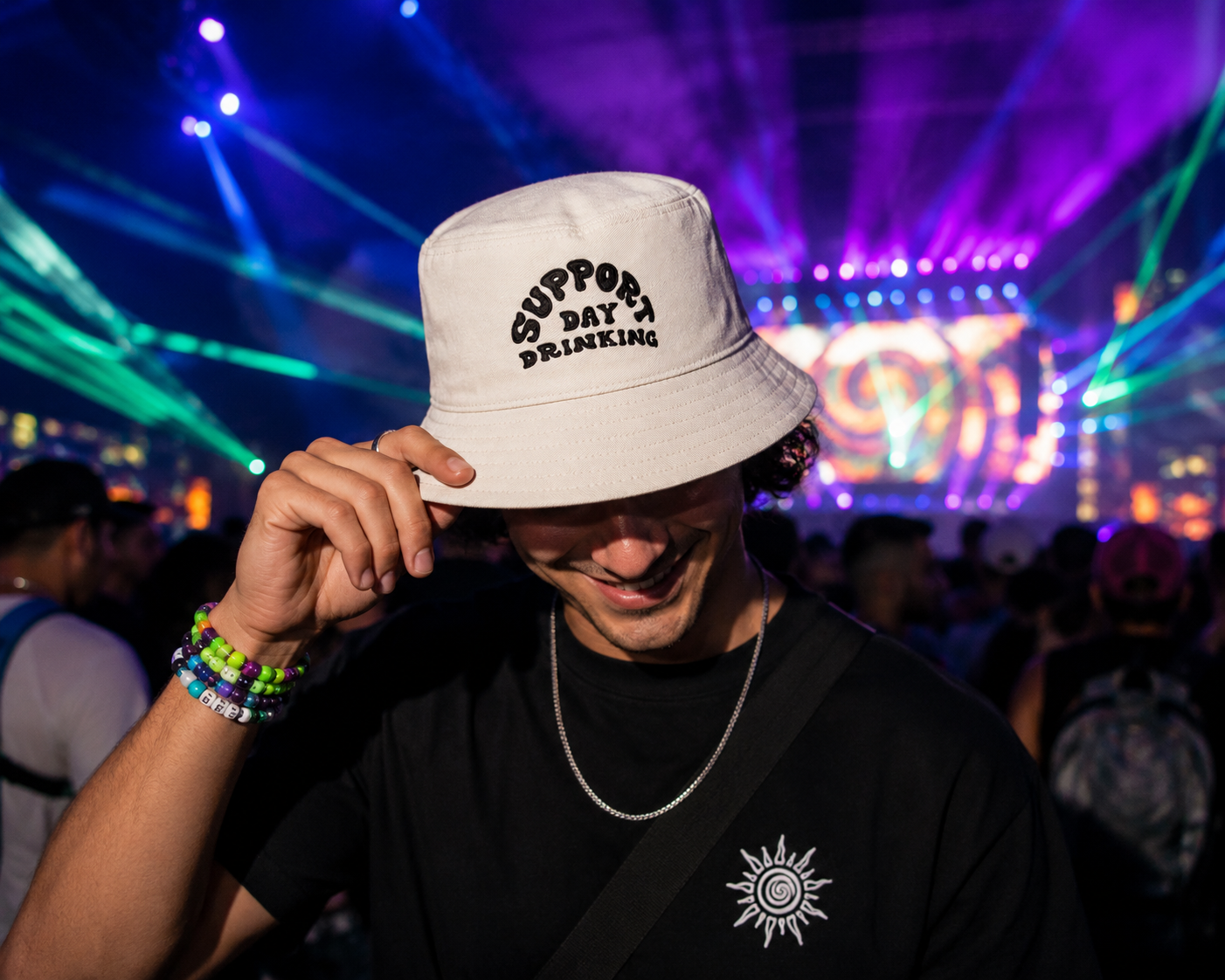 Man wearing Support Day Drinking off white bucket hat at festival