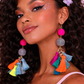 Model wearing colourful tassel earrings festival styling UK