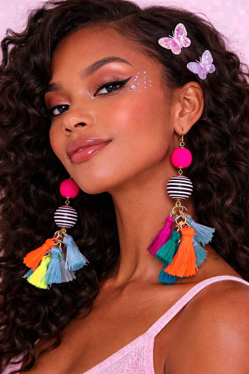 Model wearing colourful tassel earrings festival styling UK