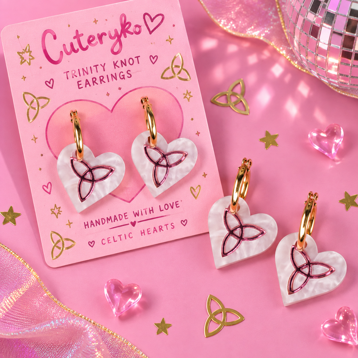 Trinity Knot hoop earrings with pearlescent heart charms and Celtic knot detailing by Cuteryko