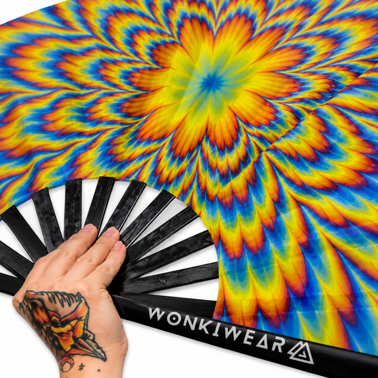 Close-up of psychedelic optical illusion artwork on UV reactive festival fan