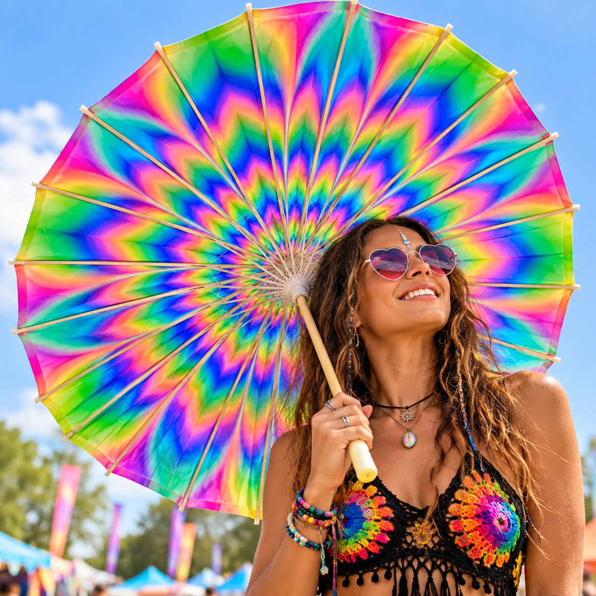 Trippy rainbow festival parasol held by a woman at a colourful outdoor rave