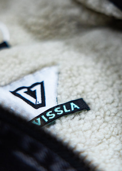 Close-up of the sherpa lining and Vissla brand label inside the Wasson jacket