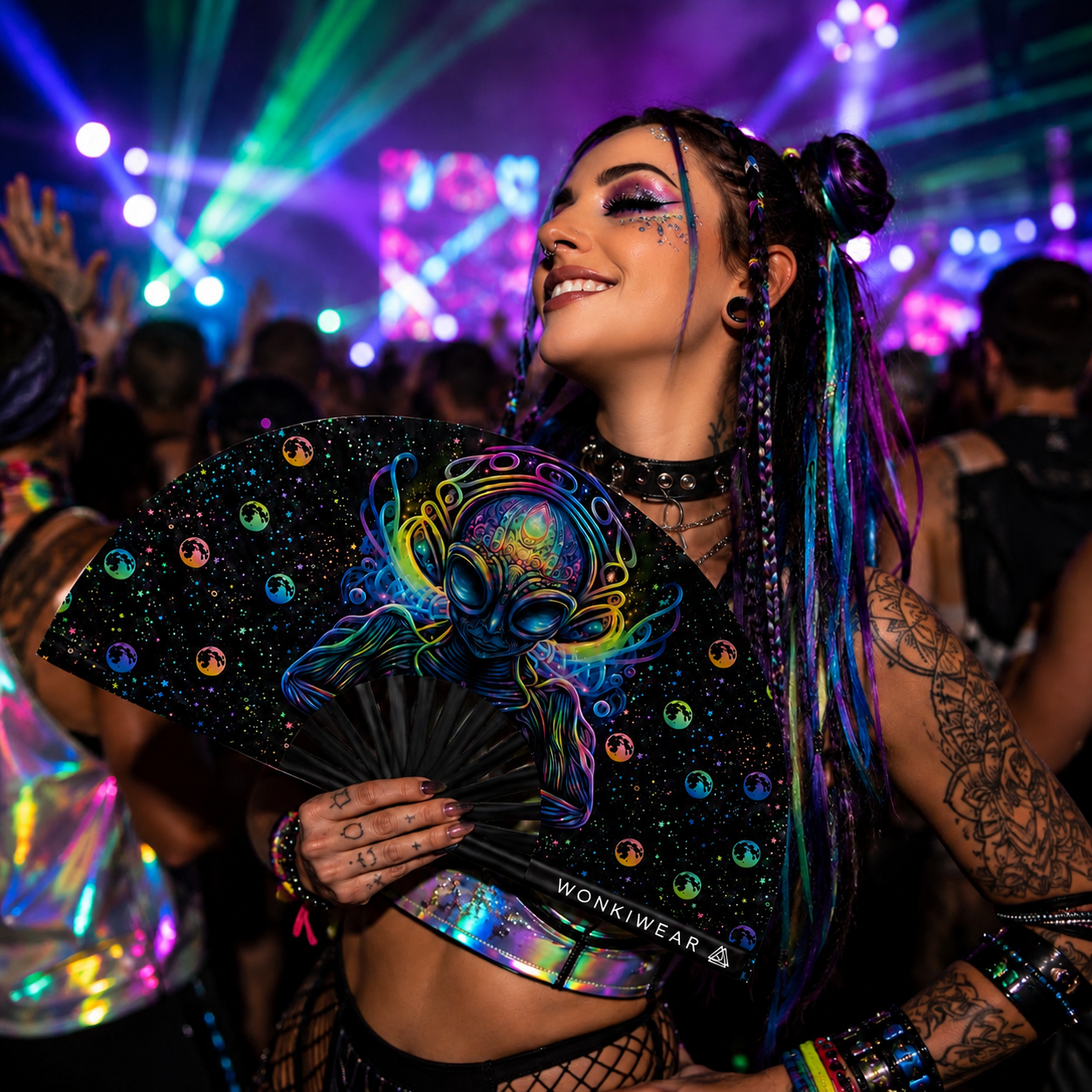 Festival-goer using the Voidwalker psychedelic alien folding fan at a rave
