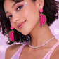 Model wearing watermelon earrings festival styling