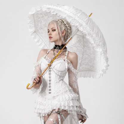Alternative bride holding white Victorian lace umbrella in gothic inspired fashion shoot