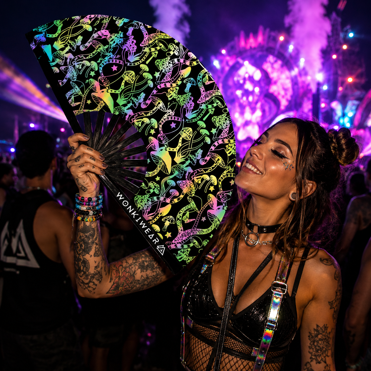 Female festival model holding XL flash reflective mushroom rave fan