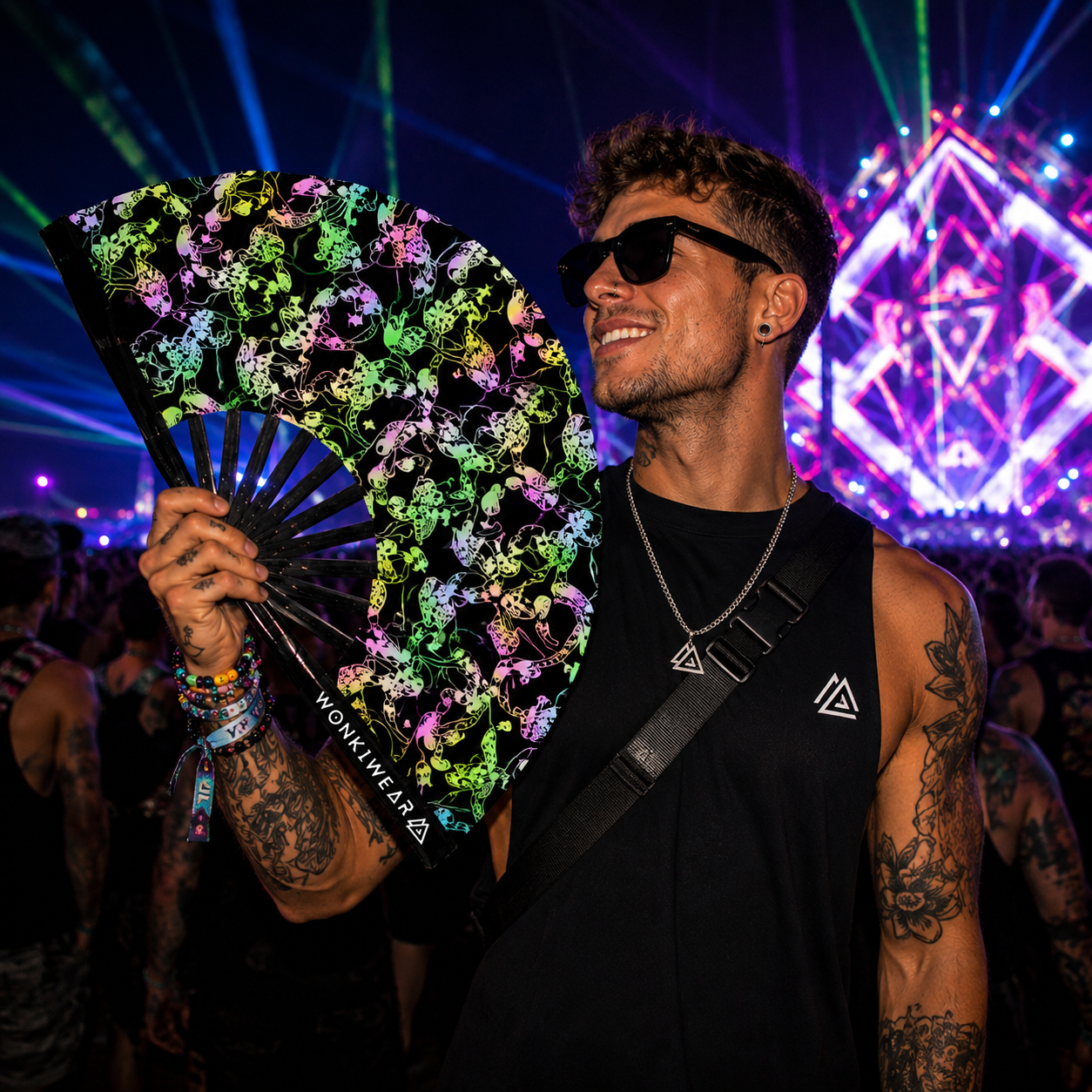 Male rave model holding XL reflective mushroom festival fan