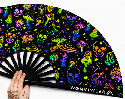Close up detail of UV reactive mushroom and skulls festival fan fabric and black bamboo ribs