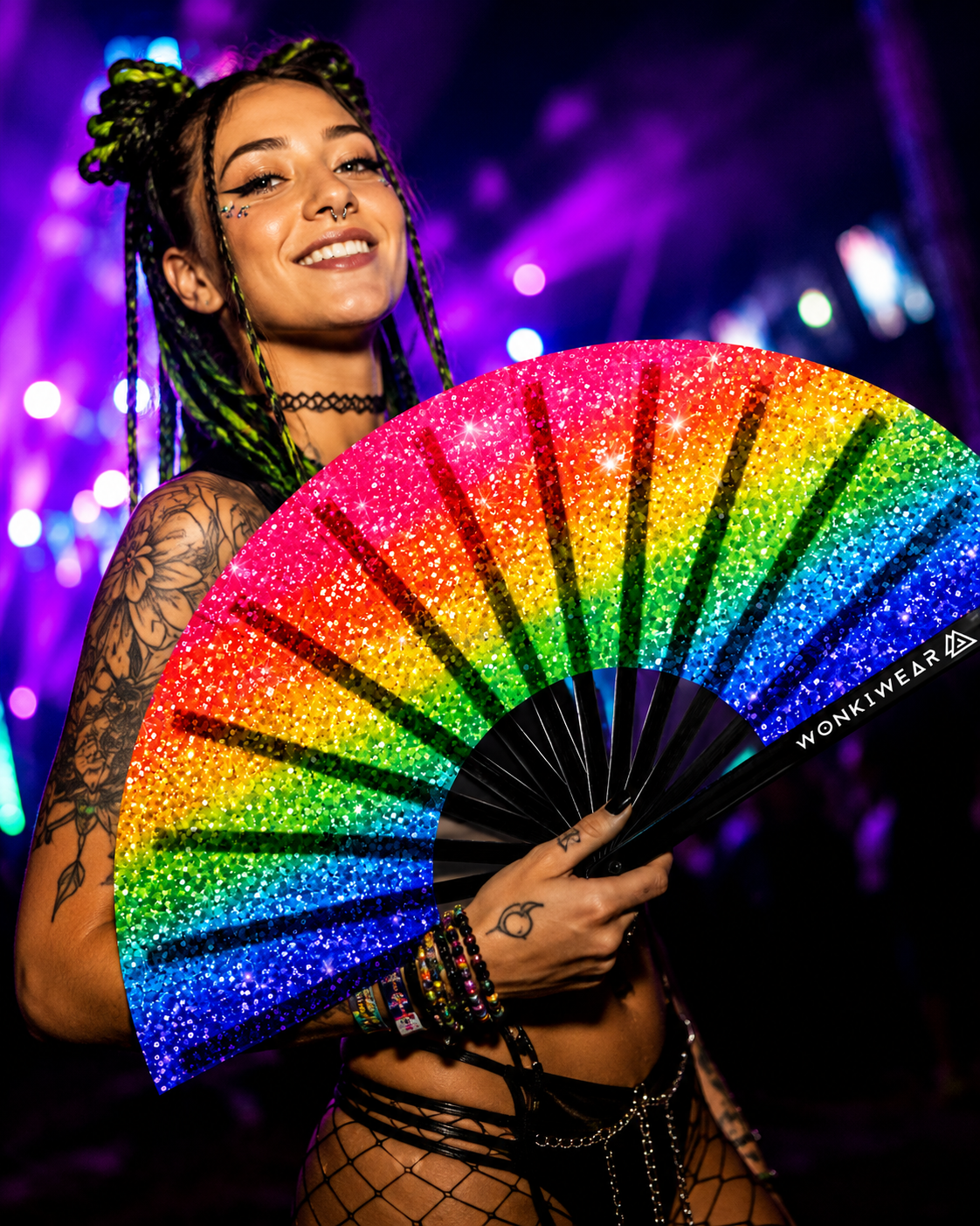 Festival crowd using rainbow Pride printed glitter effect rave fan