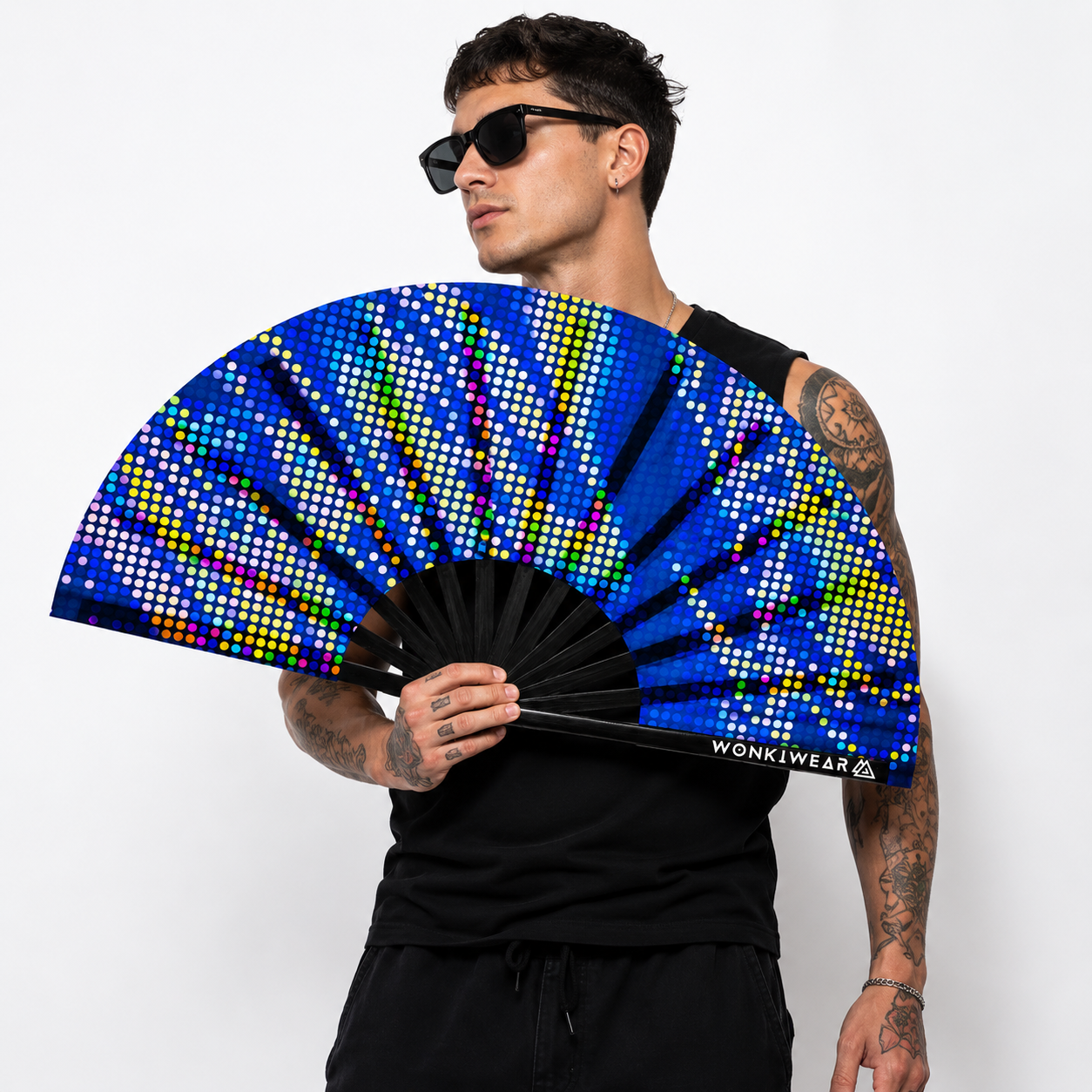 Male festival model holding XL UV reactive blue pixel burst rave fan