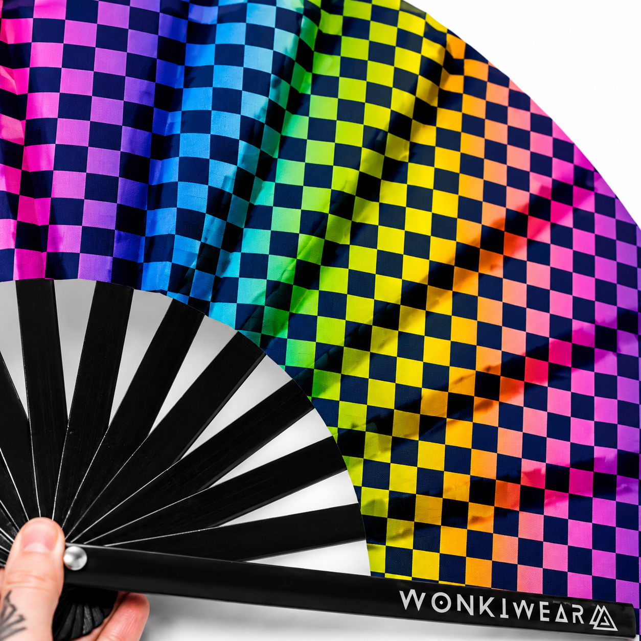 Close up detail of checkerboard UV reactive rave fan print and black bamboo ribs