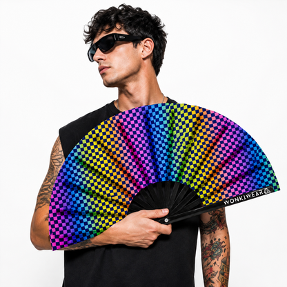 Male festival model holding XL UV reactive chequered rave fan