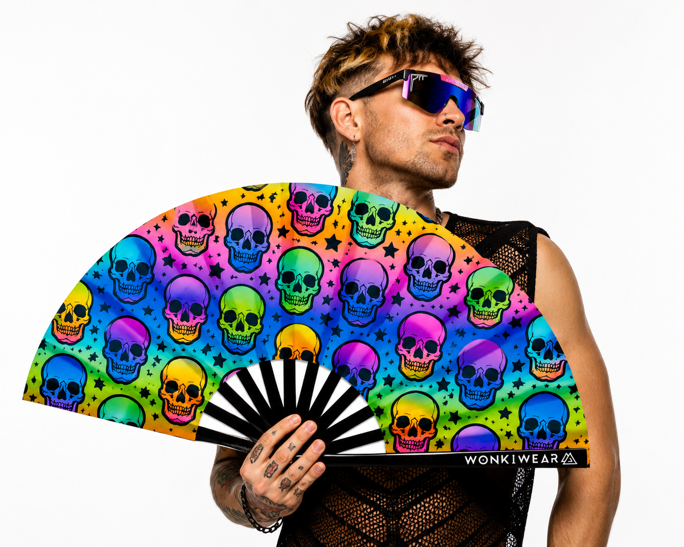 Male festival model holding XL UV reactive skull rave fan