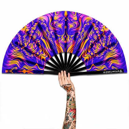 XL UV reactive trippy orange and blue festival fan with black bamboo ribs on white background