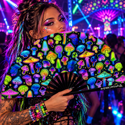 Woman holding an XL UV reactive mushroom festival fan at a neon rave