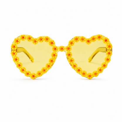 Yellow heart shaped daisy festival glasses on white background