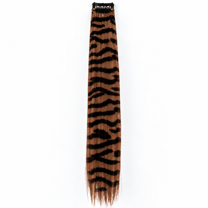 Brown and black zebra-striped clip-in hair extension with long synthetic strands.