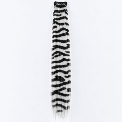 White and black zebra-striped clip-in hair extension with long synthetic strands.
